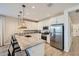 Bright kitchen featuring granite countertops, stainless steel appliances, and a large island with bar seating at 8035 E Paloma Ave, Mesa, AZ 85212
