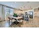 Inviting open floor plan with dining area, island seating and access to the kitchen at 8035 E Paloma Ave, Mesa, AZ 85212