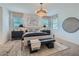 Serene main bedroom featuring neutral tones, soft carpet, and contemporary lighting fixtures at 8035 E Paloma Ave, Mesa, AZ 85212