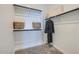 Spacious walk-in closet with ample shelving and hanging space for clothing and accessories at 8035 E Paloma Ave, Mesa, AZ 85212