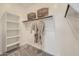 Walk-in closet with built-in shelving and ample hanging space for organization at 8142 E Petra Ave, Mesa, AZ 85212