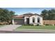 Charming single-story home featuring a classic stucco exterior and well-manicured lawn at 8142 E Petra Ave, Mesa, AZ 85212