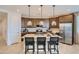 Modern kitchen with stainless steel appliances, a center island, and stylish pendant lighting at 8142 E Petra Ave, Mesa, AZ 85212