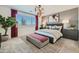 Beautiful main bedroom with stylish lighting, patterned accent wall, and neutral colors at 8142 E Petra Ave, Mesa, AZ 85212