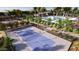 Aerial view of community pickleball court and pool with lounge seating surrounded by lush landscape at 8142 E Petra Ave, Mesa, AZ 85212