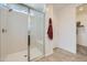 Bright tiled shower with bench and glass doors in a modern bathroom at 8142 E Petra Ave, Mesa, AZ 85212