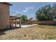 The large backyard with mature trees includes a pool and patio at 8469 W Emile Zola Ave, Peoria, AZ 85381