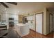 Modern kitchen featuring an island, stainless steel appliances, white cabinets and lots of storage space at 8469 W Emile Zola Ave, Peoria, AZ 85381