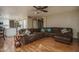 Spacious open-concept living room connecting seamlessly with kitchen, and hardwood floors at 8469 W Emile Zola Ave, Peoria, AZ 85381