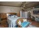 Spacious bedroom features a ceiling fan, sitting area, and hardwood floors at 8469 W Emile Zola Ave, Peoria, AZ 85381