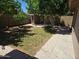 Spacious backyard with trees and a mix of grass and dirt at 909 W Mesquite St, Chandler, AZ 85225