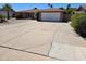 Charming single story home featuring a spacious driveway with a two car garage at 909 W Mesquite St, Chandler, AZ 85225