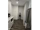 Well-lit kitchen with stainless steel appliances and wood plank flooring at 909 W Mesquite St, Chandler, AZ 85225