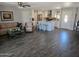 Open-concept living room featuring modern wood-look floors and a kitchen with island at 909 W Mesquite St, Chandler, AZ 85225