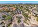 Aerial view of a well-maintained gated community with lush landscaping and mature palm trees at 9571 N 117Th St, Scottsdale, AZ 85259