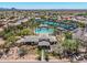 Aerial view showcasing a luxurious community pool, tennis courts, and beautiful landscaping at 9571 N 117Th St, Scottsdale, AZ 85259