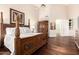 This bedroom boasts a stunning four-poster bed and an adjoining bathroom for added convenience and privacy at 9571 N 117Th St, Scottsdale, AZ 85259
