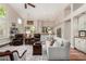 Open-concept living space with vaulted ceilings, hardwood floors, and seamless flow into the kitchen at 9571 N 117Th St, Scottsdale, AZ 85259