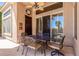 Covered patio featuring metal outdoor furniture and a ceiling fan to keep you cool and comfortable at 9571 N 117Th St, Scottsdale, AZ 85259