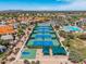 Aerial view of community tennis courts and a basketball court, surrounded by green landscaping at 9571 N 117Th St, Scottsdale, AZ 85259