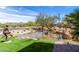 Artistic water feature with sculptures and lush landscaping, creating a serene community entrance at 9571 N 117Th St, Scottsdale, AZ 85259