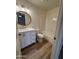Bathroom featuring a round mirror, modern vanity, and shower-tub combination at 97 N Cooper Rd # 97, Chandler, AZ 85225