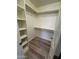 Walk in closet with rod and shelf storage and vinyl floors at 97 N Cooper Rd # 97, Chandler, AZ 85225