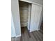 A well-organized closet offers plenty of storage space with custom shelving and a sliding door at 97 N Cooper Rd # 97, Chandler, AZ 85225
