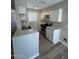 Newly remodeled kitchen featuring white cabinets, modern countertops, and stainless steel oven at 97 N Cooper Rd # 97, Chandler, AZ 85225