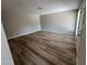 A bright and airy living room features stylish wood-look floors, neutral walls, and ample space at 97 N Cooper Rd # 97, Chandler, AZ 85225