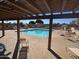 Community pool with a pergola and various outdoor seating, perfect for relaxation at 97 N Cooper Rd # 97, Chandler, AZ 85225