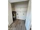 Utility closet with a water heater and laminate floors, offering practical storage space at 97 N Cooper Rd # 97, Chandler, AZ 85225