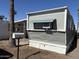 Exterior view of gray mobile home with unit number and exterior air conditioning unit at 9913 E Main St # 40, Mesa, AZ 85207