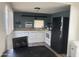 Eat-in kitchen area with modern laminate flooring and white cabinetry at 9913 E Main St # 40, Mesa, AZ 85207