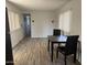 Open-concept living area with bright walls, laminate flooring and decorative lighting at 9913 E Main St # 40, Mesa, AZ 85207