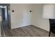 Open-concept living area with bright walls, laminate flooring and decorative lighting at 9913 E Main St # 40, Mesa, AZ 85207