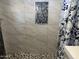 Close up of shower with decorative accent tile and grey marble wall tile at 9913 E Main St # 40, Mesa, AZ 85207