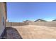 A view of a spacious backyard with dirt landscaping and block wall fencing at 10430 E Sunflower Ln, Florence, AZ 85132