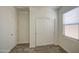 Comfortable bedroom with closet and window at 10430 E Sunflower Ln, Florence, AZ 85132