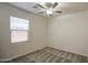 Bright bedroom featuring a ceiling fan and a window for ample natural light at 10430 E Sunflower Ln, Florence, AZ 85132