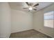 Inviting bedroom with plush carpeting and a ceiling fan at 10430 E Sunflower Ln, Florence, AZ 85132
