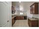 The kitchen is updated with granite counters, dark wood cabinetry, and modern appliances at 10430 E Sunflower Ln, Florence, AZ 85132