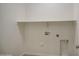 View of a laundry room with a shelf and washer-dryer hookups at 10430 E Sunflower Ln, Florence, AZ 85132