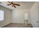 Spacious primary bedroom with ceiling fan and en-suite bathroom at 10430 E Sunflower Ln, Florence, AZ 85132