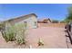 The backyard has desert landscaping, a block wall and a covered patio at 1125 E Milada Dr, Phoenix, AZ 85042