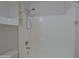 Bathroom shower with adjustable shower head and convenient built-in shelving for shower essentials at 1125 E Milada Dr, Phoenix, AZ 85042