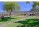 Beautiful community park with lush green grass, mature trees, a walking path, and mountain views at 1125 E Milada Dr, Phoenix, AZ 85042