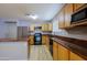 Bright kitchen boasts stainless appliances, plenty of cabinet space, and an island perfect for cooking at 1125 E Milada Dr, Phoenix, AZ 85042