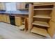 Pantry cabinet features pull-out shelves for organizing kitchen essentials and appliances at 1125 E Milada Dr, Phoenix, AZ 85042