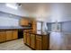 Spacious kitchen with a large island and seamless flow into the dining and living areas at 1125 E Milada Dr, Phoenix, AZ 85042